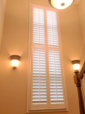 Tall window with plantation shutters